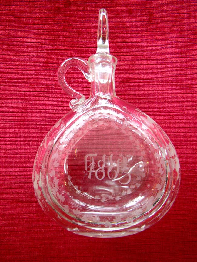 A wonderful Civil War era etched glass decanter dated 1865